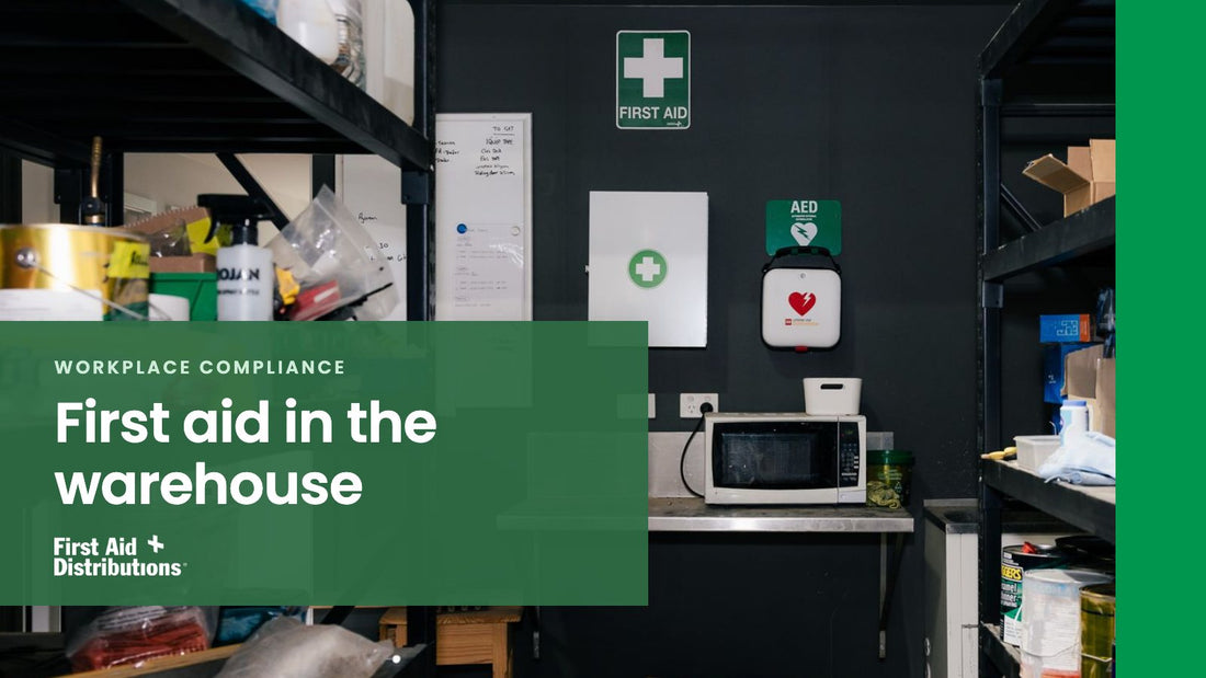First aid in the warehouse: a first aid station on a warehouse wall, with a first aid sign, first aid cabinet and wall-mounted defibrillator between storage shelves, First Aid Distributions