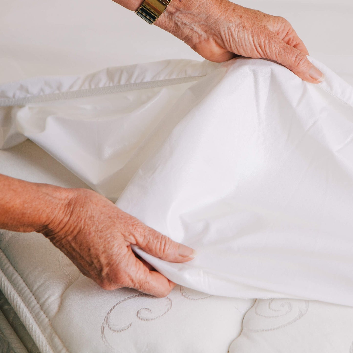 Conni premium waterproof mattress protector with micro-plush technology, designed for incontinence bedding, featuring soft, protective layers.