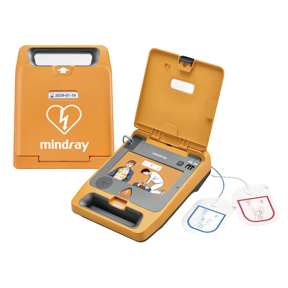 Mindray BeneHeart C1A AED open, showing the illustrated guidance panel, speaker and the single connected pair of electrode pads used for both adults and children