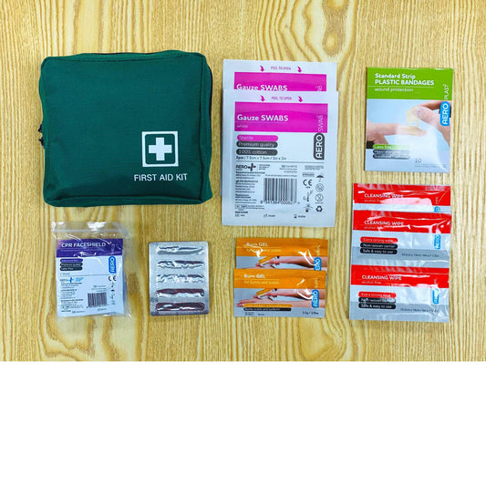 Small First Aid Distributions pocket kit with bandages, antiseptic wipes, and first aid supplies for personal or workplace use.